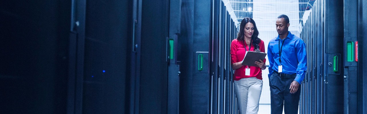 Man and woman in large data center
